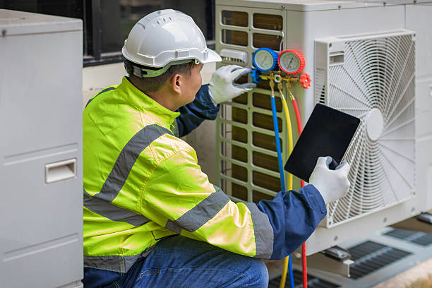 Professional Hvac technician working in South Amana, IA
